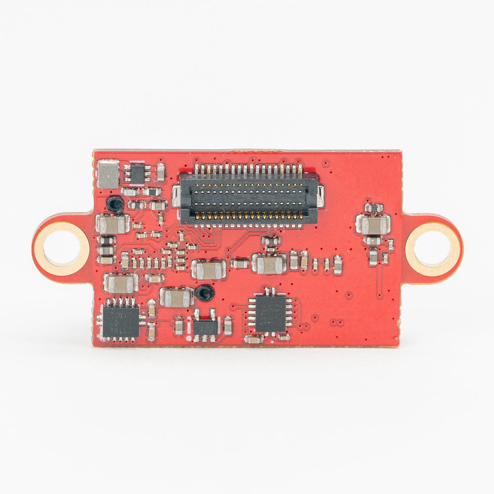 A small red electronic circuit board module with a central connector, several black integrated circuits, and two orange loop connectors on the left and right, shown on a plain white background.