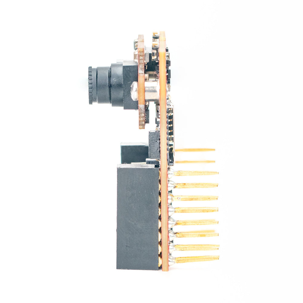 A small electronic module with a black rectangular body, a gray cylindrical component, gold-toned metal pins, and a copper-colored printed circuit board, shown against a plain white background.