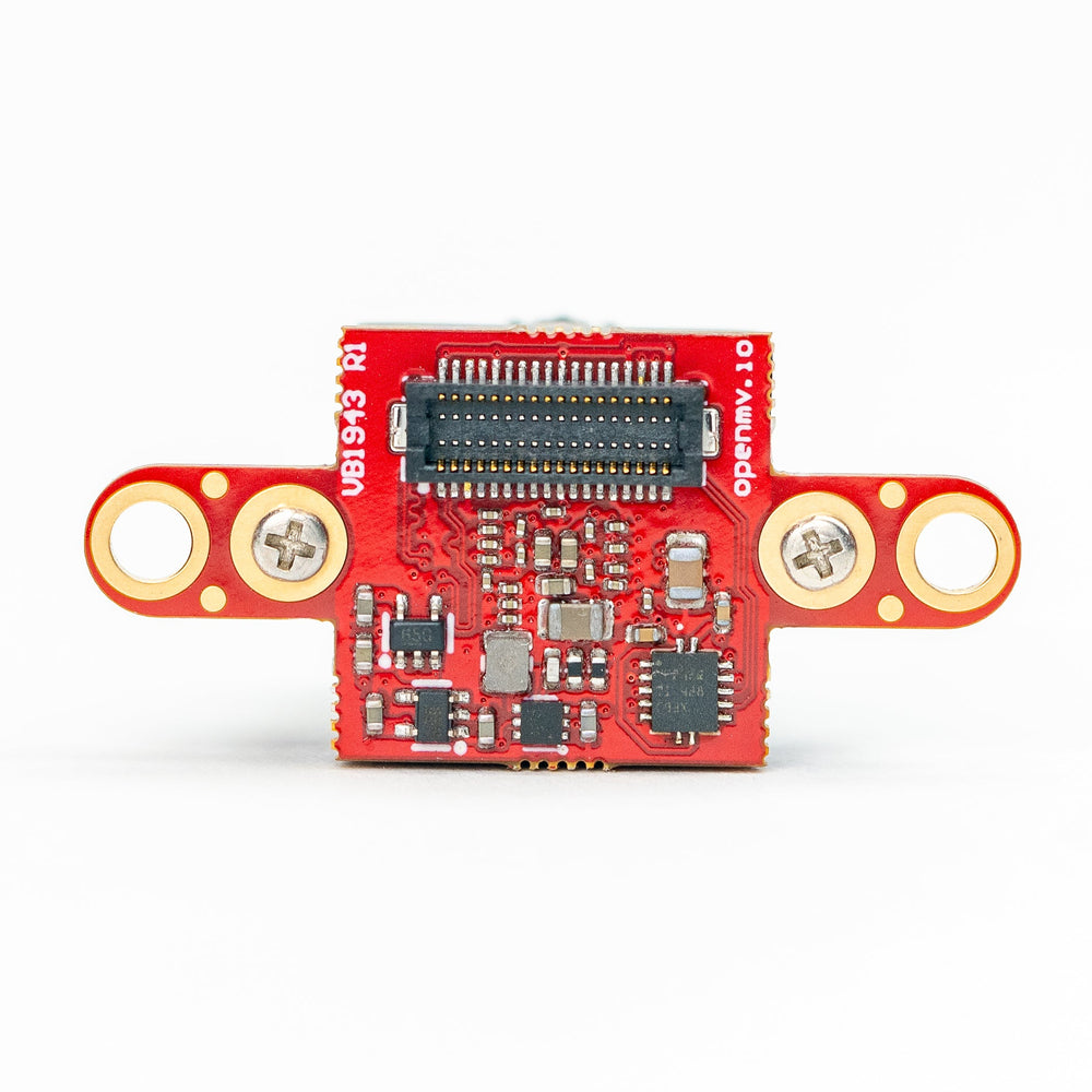 A small red electronic circuit board module with gold-colored metal terminal rings on both sides, a central black connector, and various surface-mounted electronic components, photographed on a clean white background.